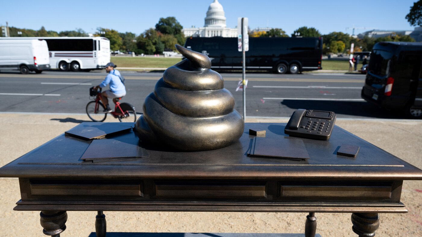 Pelosi poop desk joined by tiki torch statue in D.C. : NPR