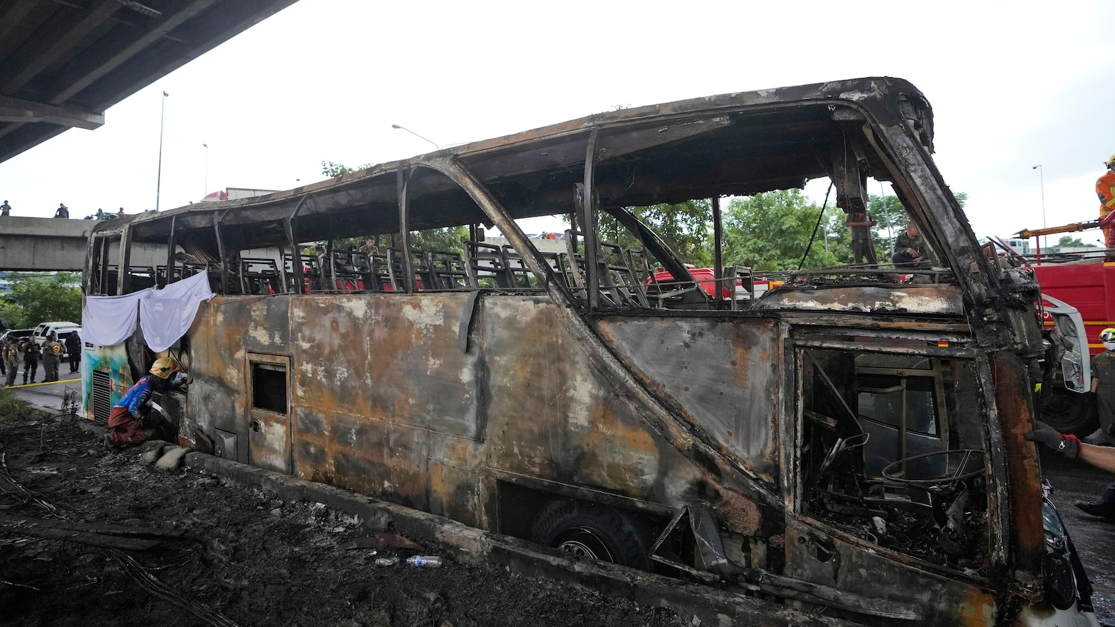 School bus catches fire outside Bangkok and over 20 are feared dead, officials say