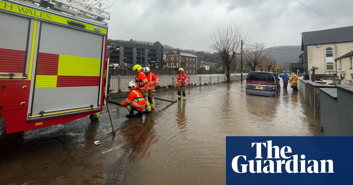 Pontypridd residents make frantic efforts to protect homes as river floods | UK weather